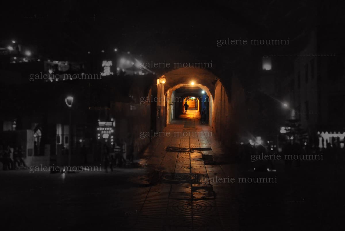A photo from the "Arches" exhibition in one of the alleyways of Essaouira.